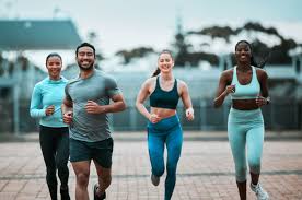 image of people running to incorporate cardio Ramsgate exercise into their life to help tone arms and body.