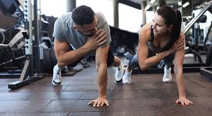Image of man and woman doing Cardio Ramsgate to tone their arms. 